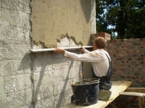Нанесение цементной штукатурки на армирующую сетку